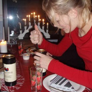 December 2007
At a friend's house; pizza and parlor games. 
My friend is having a hard time opening her can of cider..
Btw, see the candlestick in the