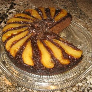 A twist on the Upside-Down Pear Gingerbread Cake of note in the novel, Eat Cake, by Jeanne Ray. The best cake I've had in decades. It's cooked in a ca