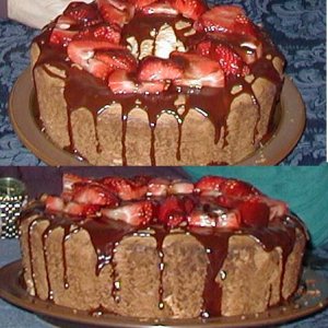 I made this angel food cake for my anniversary.  It's covered with a chocolate ganache sauce and fresh strawberries.  I have to say, angel food cake i