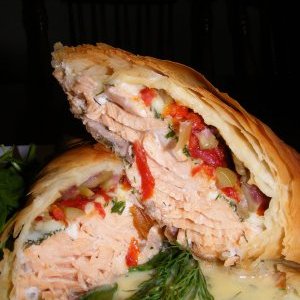 Salmon in phyllo with sundried tomatoes, dill, olives and asiago with dill beurre blanc