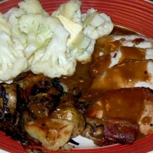 Pork loin roast, roasted tater, mushrooms and onions, pan gravy and steamed cauliflower.