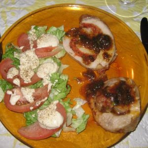 Low carb supper of pork roulade with pan sauce and salad