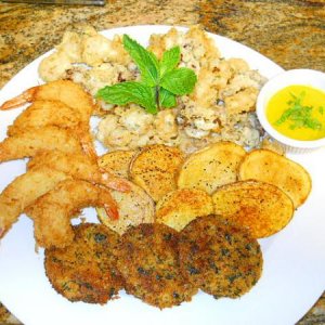 Coconut shrimp,tempura squid,saffron and garlic aioli,tater fries,and fried green tomato's