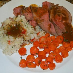 Roast Beef, candied carrots, and rice with onion, tomato, and basil.