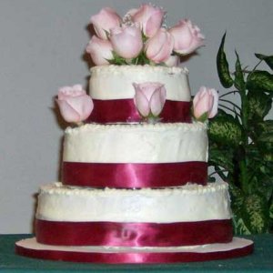 My first cake using real roses and ribbons.