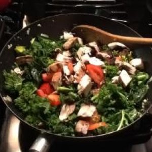 Kale and garlic stir fry: topped with chopped tomatoes, shiitake mushrooms and garlic oil.
