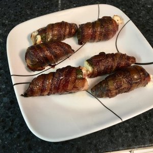 Atomic Buffalo Turds (Jalapeños stuffed with cream cheese and kielbasa and wrapped with bacon)