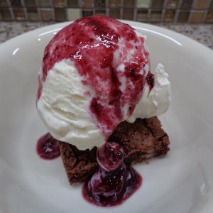Brownie ala mode with blackberry compote
