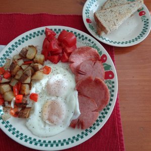 A Typical Sunday Brunch: Basted Eggs, Potatoes O'Brian, diced Tomatoes and sliced&fried Taylor Pork Roll aka Taylor's Ham to my DH, oh and Rye Toast o