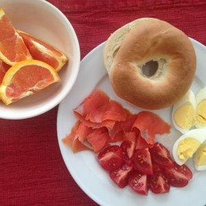 For DH, NO cream Cheese here! 
A nice Bagel, Smoked Salmon, diced Tomatoes and a hard cooked Egg.  Oh and an Orange on the side too.