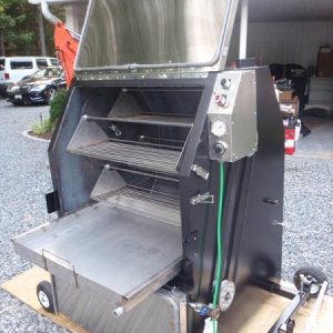 Wolf's Rotisserie cooker with stainless water pan.