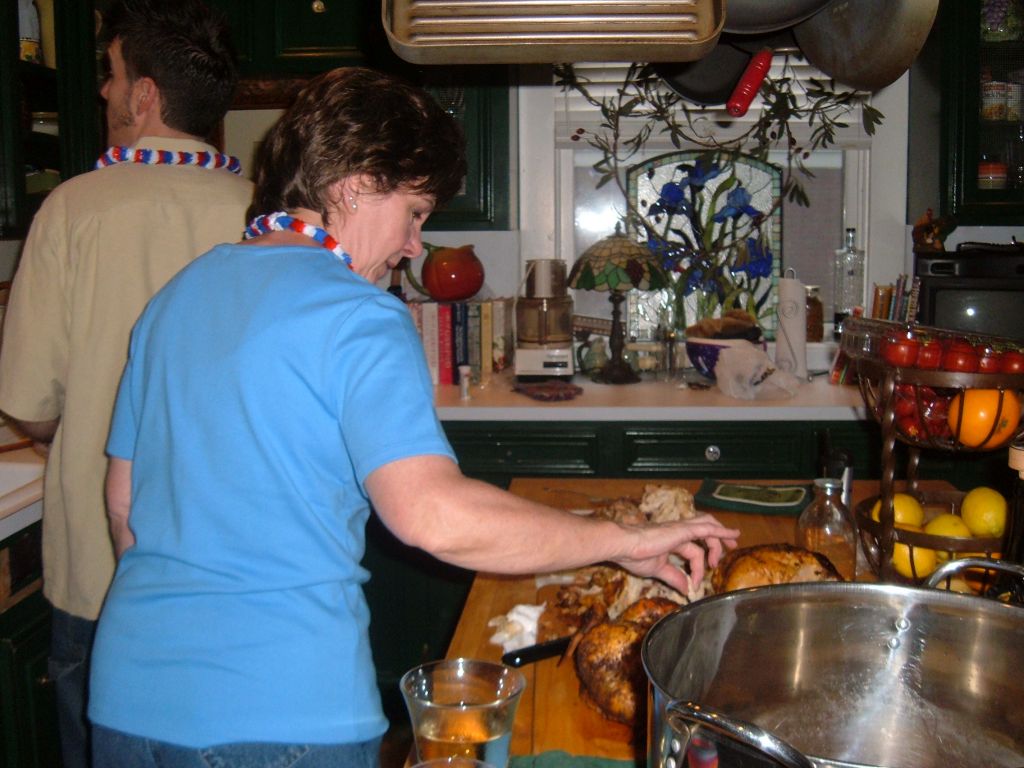A friend picking at the chickens on the counter