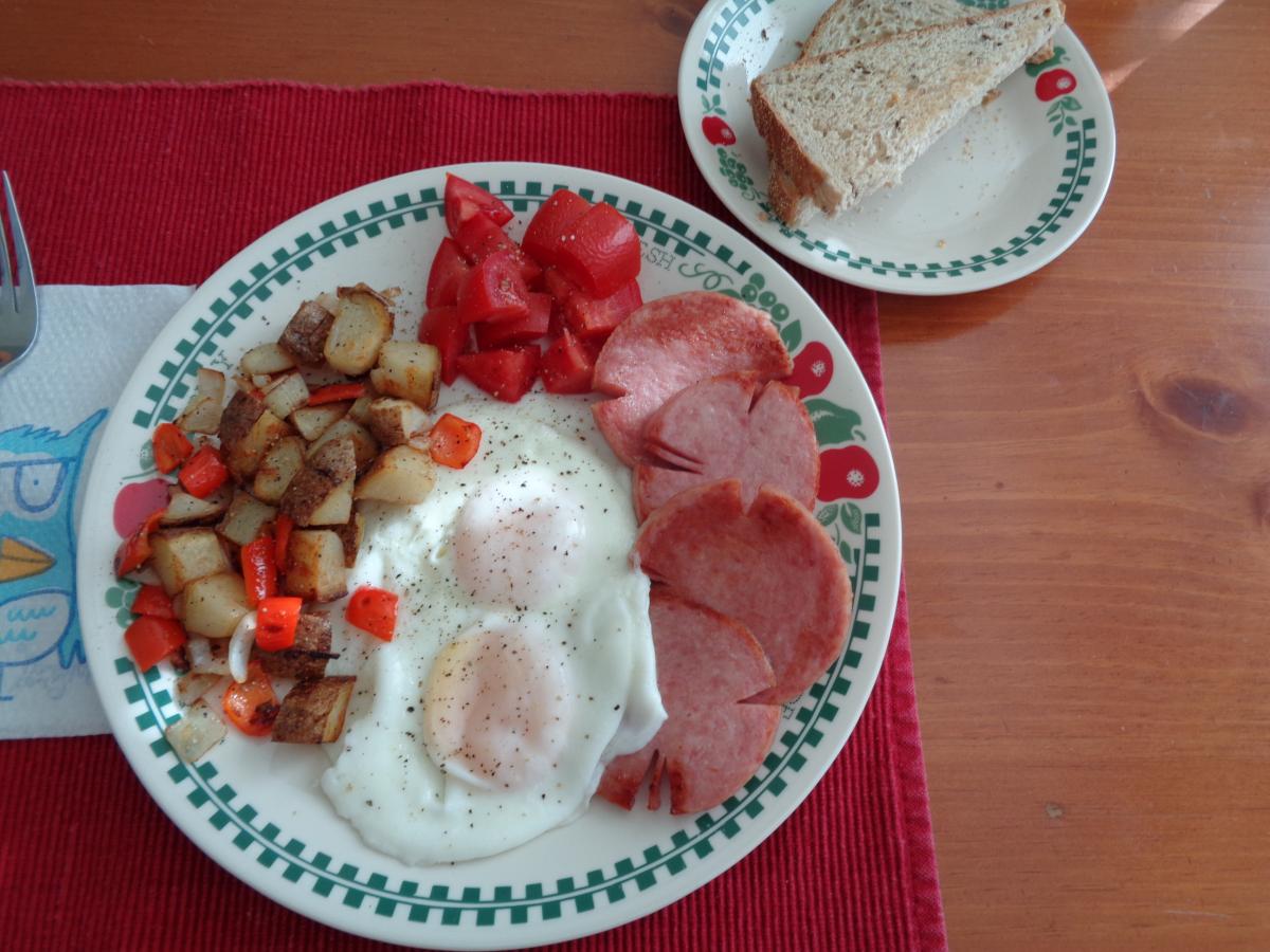 A Typical Sunday Brunch: Basted Eggs, Potatoes O'Brian, diced Tomatoes and sliced&fried Taylor Pork Roll aka Taylor's Ham to my DH, oh and Rye Toast o