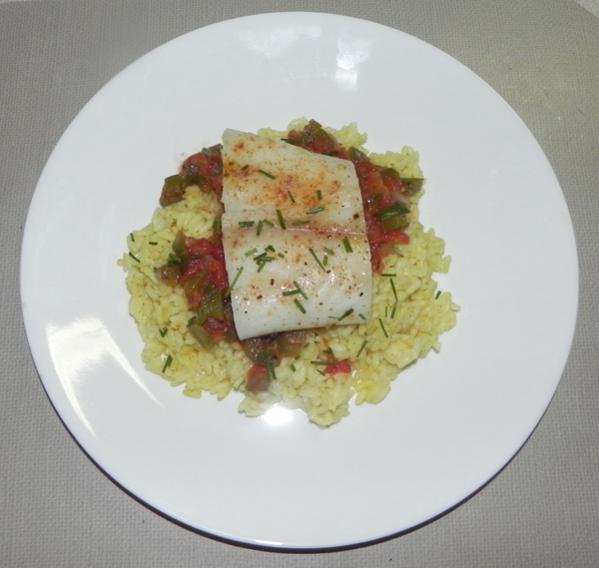 Baked cod served on tomato curry rice