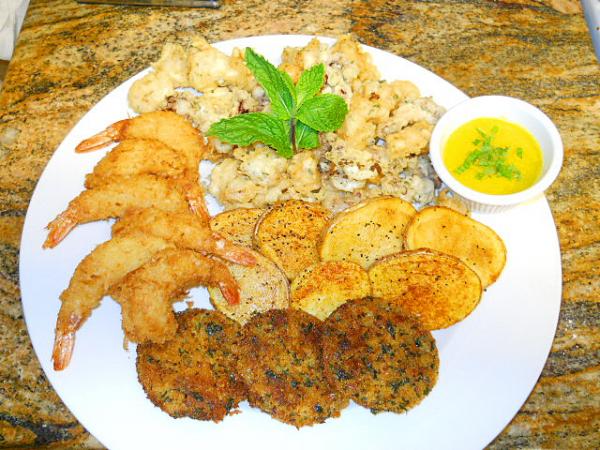 Coconut shrimp,tempura squid,saffron and garlic aioli,tater fries,and fried green tomato's