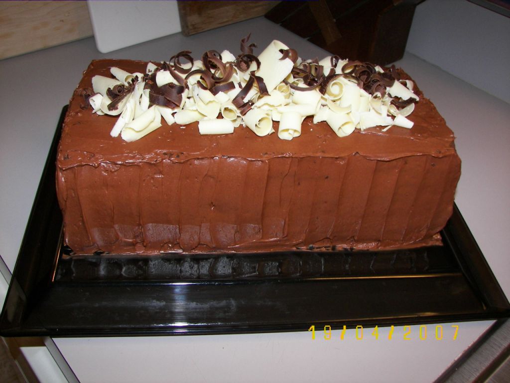 Decadent layers of dark and white chocolate ganache and dark chocolate cake. Original recipe from Food & Wine.