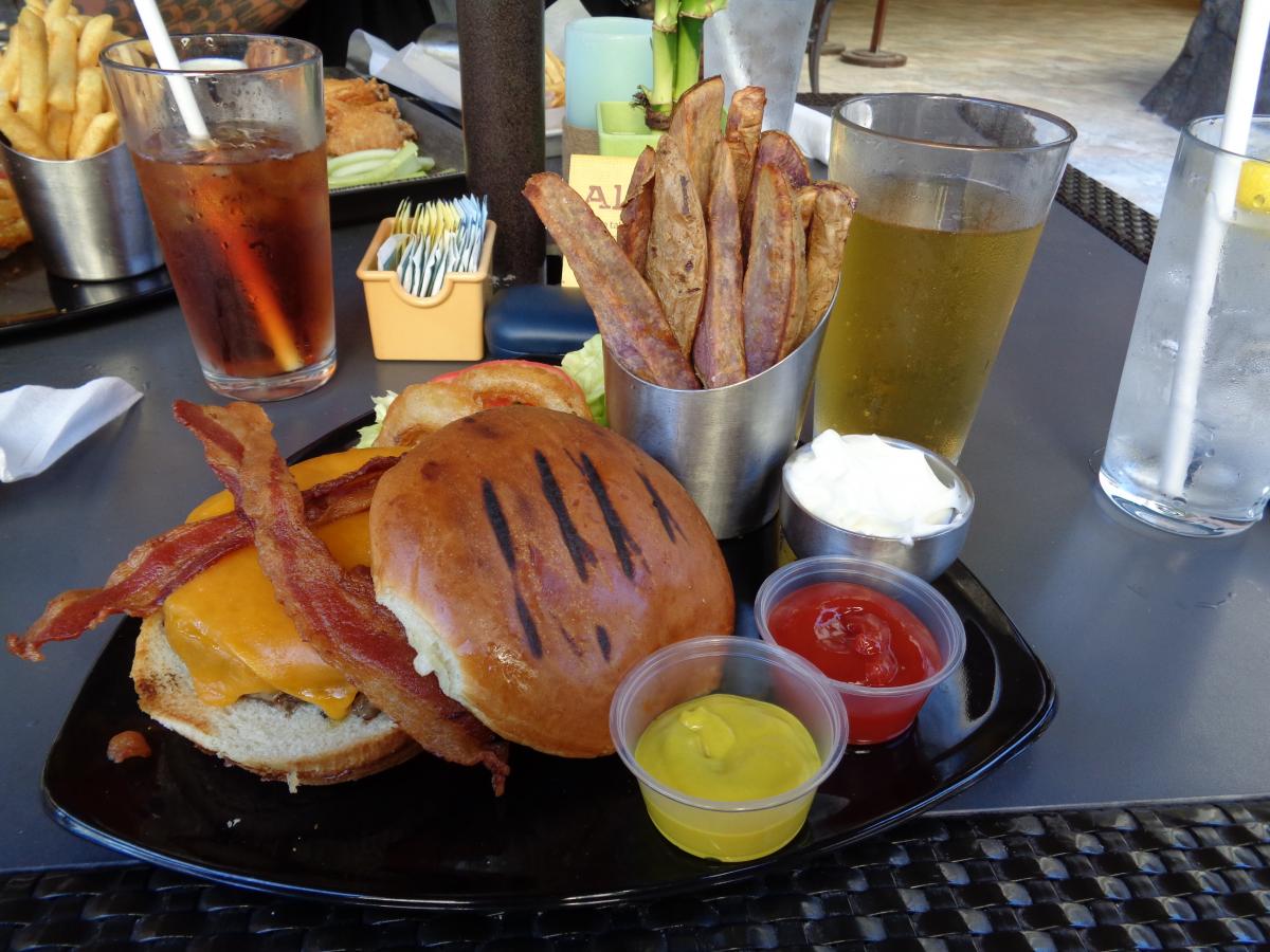 Early Supper at the Kani Ka PIla Grille in the Outrigger Reef Hotel.  Bacon Cheese Burger with a different type of fry, Okinawan Sweet Potato, interes