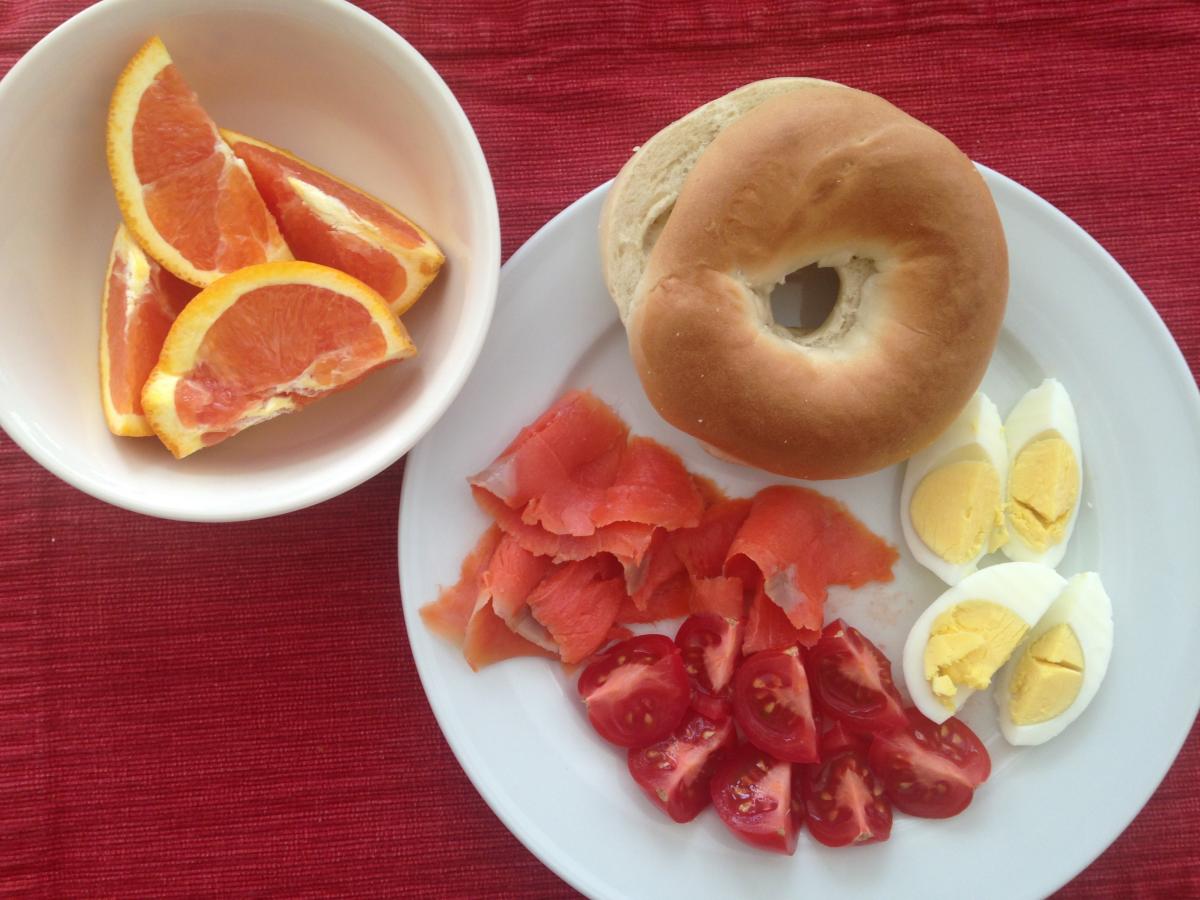 For DH, NO cream Cheese here! 
A nice Bagel, Smoked Salmon, diced Tomatoes and a hard cooked Egg.  Oh and an Orange on the side too.