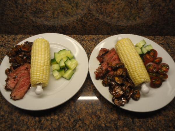 Grilled Strip Steak, Corn on the cob, grilled Mushrooms and diced Cucumbers and Tomatoes
