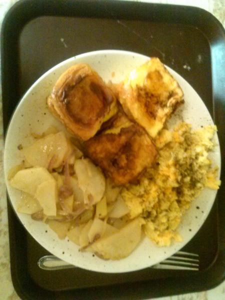 Hawaiin roll french toast, scrambled eggs w/ american and swiss cheese and potatoes