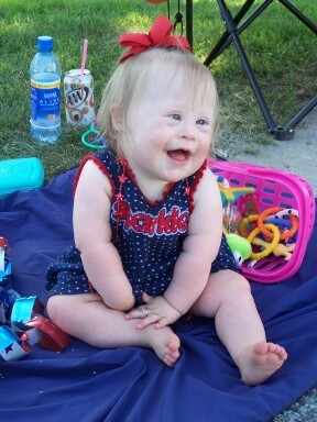 Here's my little sweet pea!  Sitting outside watching the parade.
