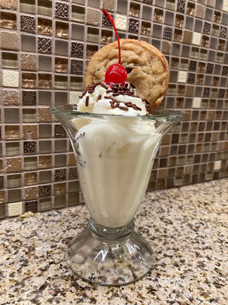 Ice Cream Sundae with a homemade Chocolate Chip Cookie as garnish, courtesy of Ms. Neighbor-Across-The-Street ... oh, and a Cherry on top too ;)