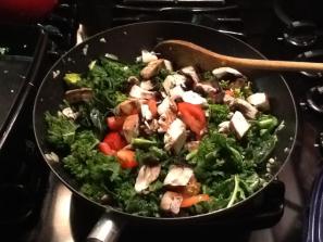 Kale and garlic stir fry: topped with chopped tomatoes, shiitake mushrooms and garlic oil.