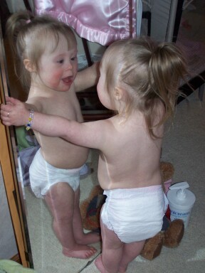 Lil miss Mayson, now 2, loves to play with that baby in the mirror!