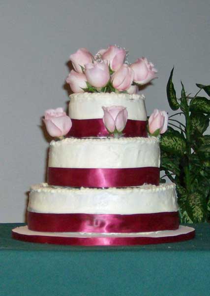 My first cake using real roses and ribbons.
