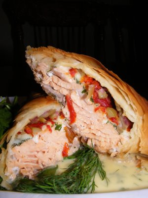 Salmon in phyllo with sundried tomatoes, dill, olives and asiago with dill beurre blanc