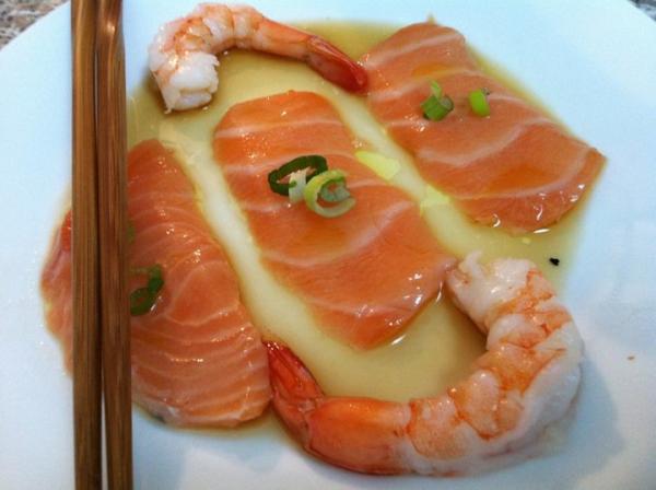 Salmon sashimi with truffle oil yuzu sauce and shrimp