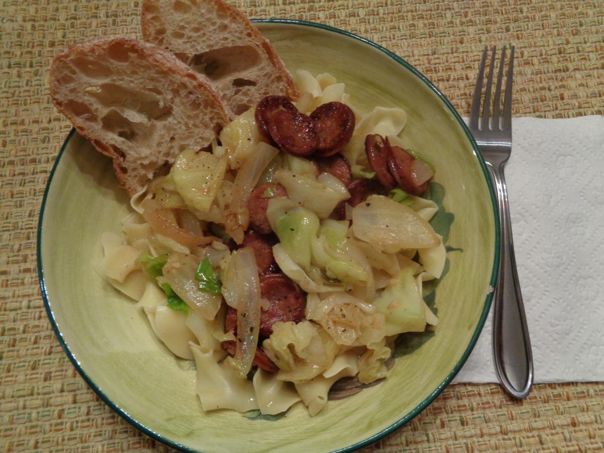 Sausage and Cabbage over Wide Egg Noodles, YUM!  I used Dickey's BBQ brand Polish Sausage, that really made it boy!