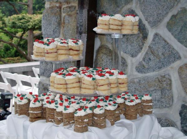 Side view of individual wedding cakes.  The top are lemon with raspberry and lemon fillings.  The bottom are banana chiffon with cream cheese buttercr