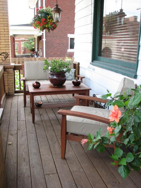 The front porch with gardenia abloom on the table.