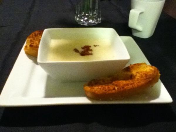 This is cream of potato soup with bacon bits, and a side of garlic bread I made at home. It was delicious. :)
