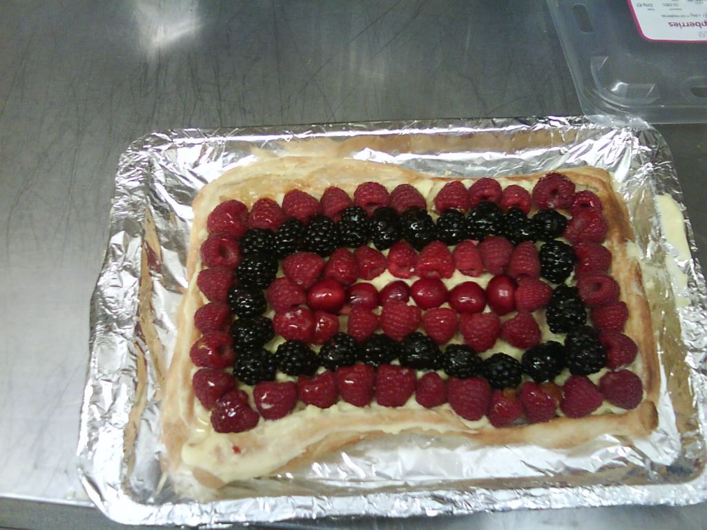 This was made by one of my year 9s (13/14 years old). A puff pastry based covered by pastry cream and decorated with fresh fruit.