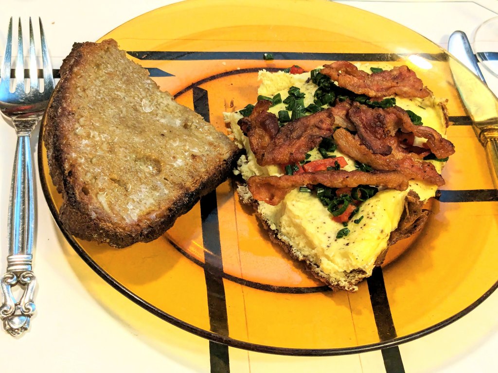 Æggekage with bacon, roasted red pepper, and scallion greens along with toasted homemade bread.jpg