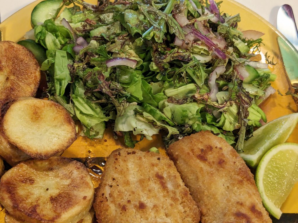 Breaded haddock, oven  potato slices, and a salad with homemade vinaigrette.jpg