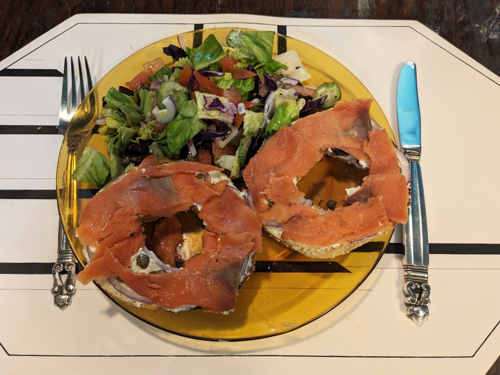 Cold smoked salmon on a bagel with cream, cheese and a salad with homemade vinegraitte.jpg