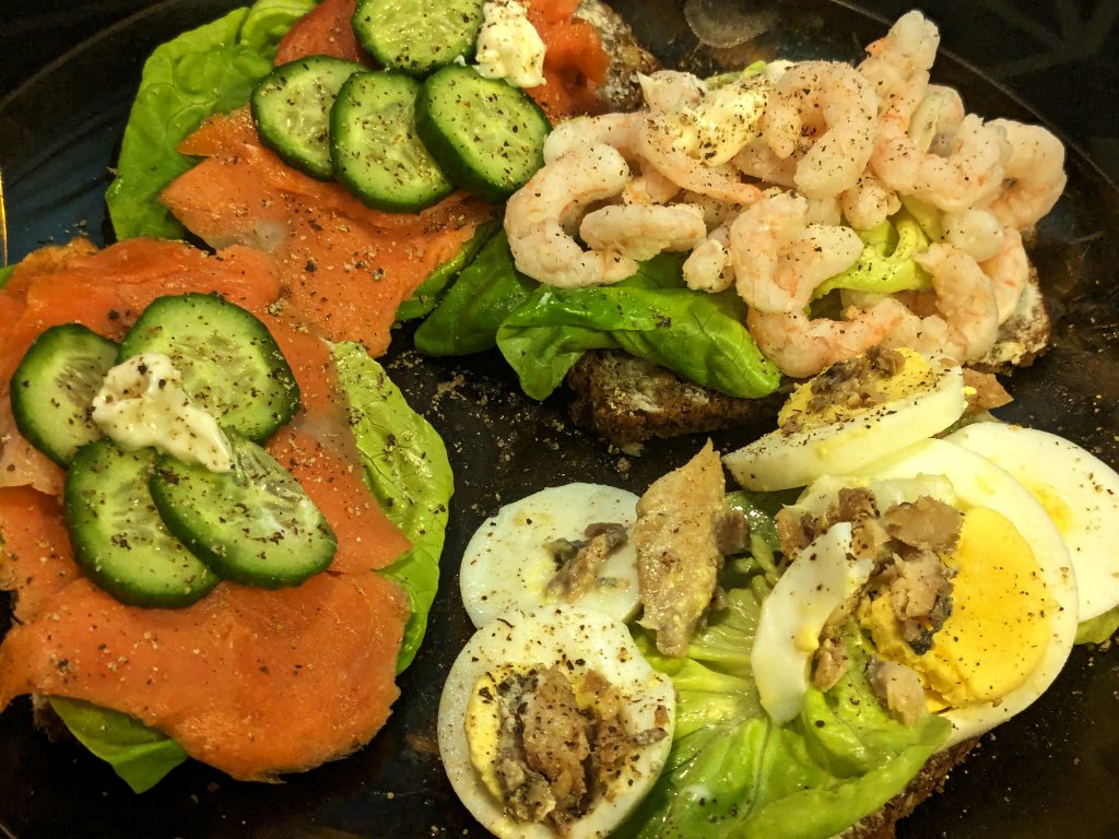 Danish smørrebrød (open faced sandwiches) of smoked salmon, shrimp, and egg with mackerel.jpg