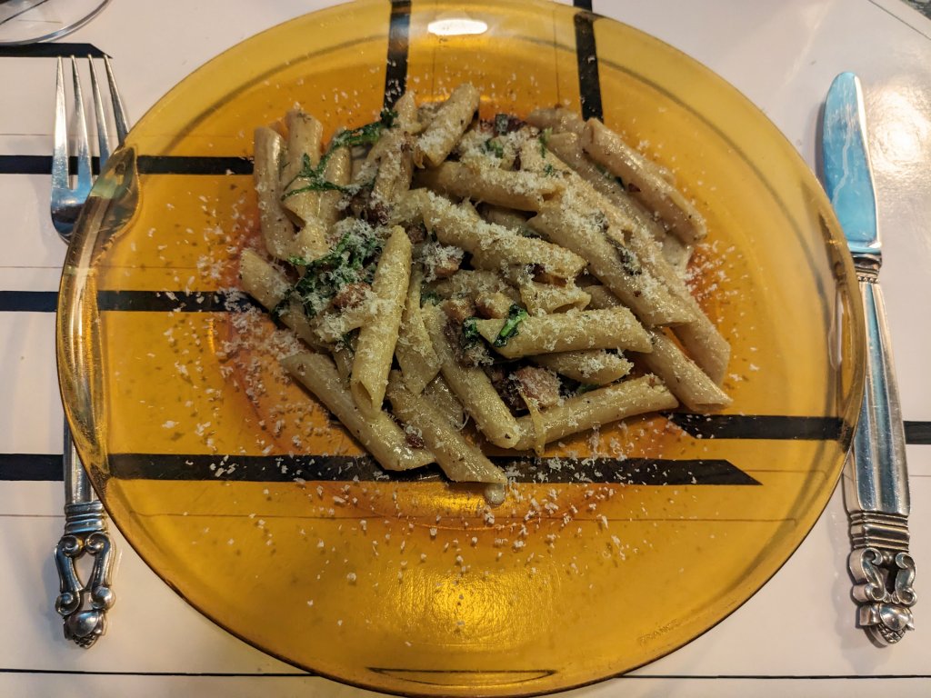 Penne pasta with bacon, cream, and greens.jpg