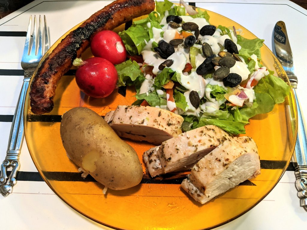 Roast chicken breast and merguez sausages, fingerling potatoes, and a salad with ranchoid dres...jpg