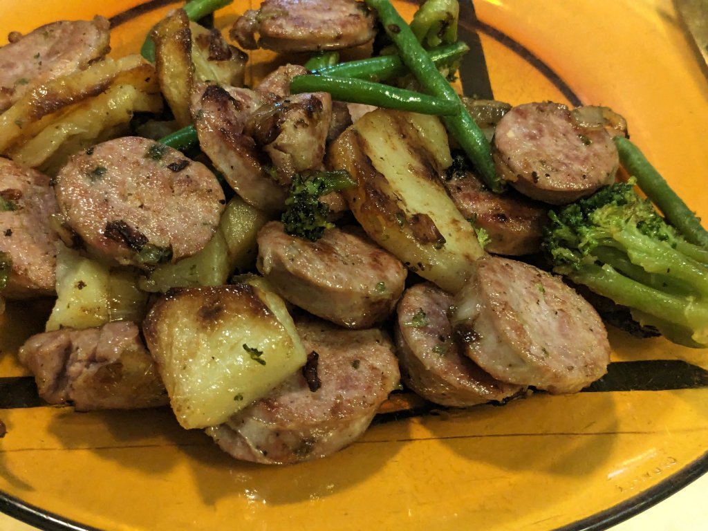 Stir fried onion, broccoli, and green beans and leftovers of sausage and potato.jpg