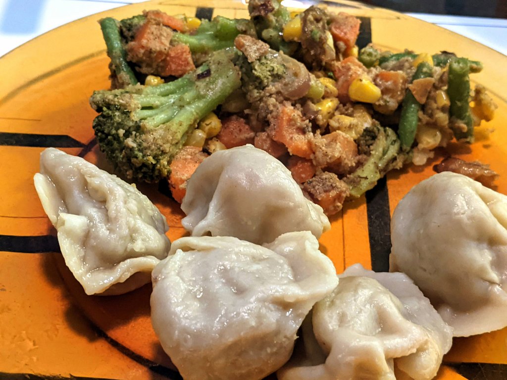 Store bought beef curry dumplings and vegis seasoned with Madras curry paste.jpg