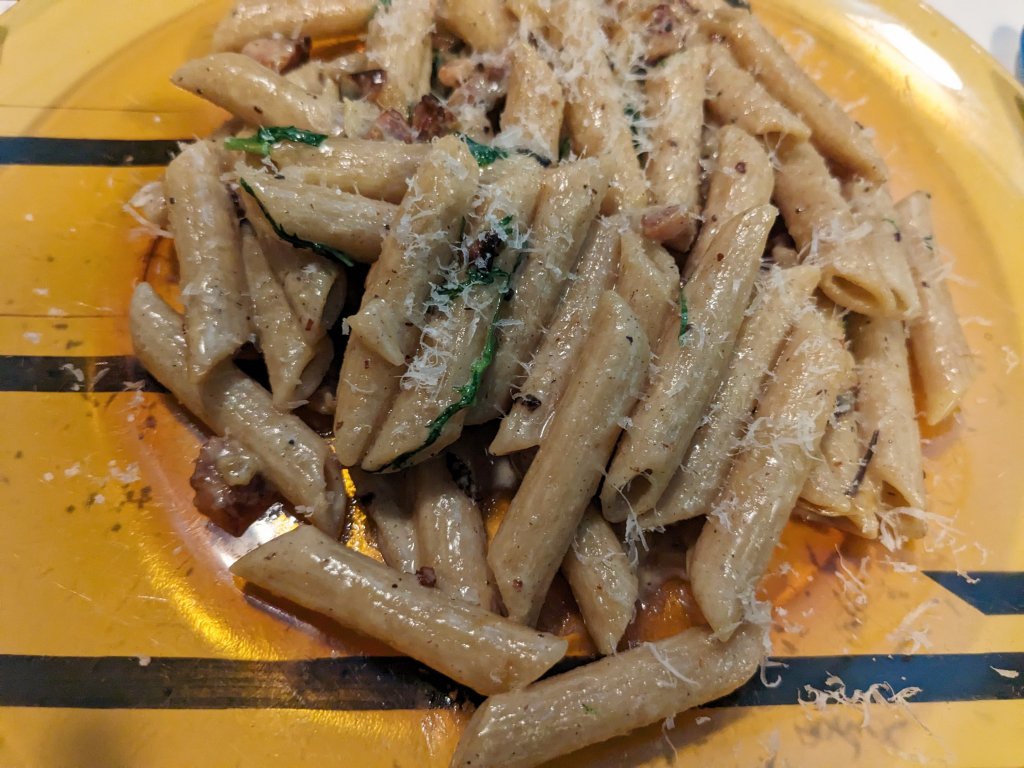 Whole wheat penne pasta with bacon, cream, and greens.jpg