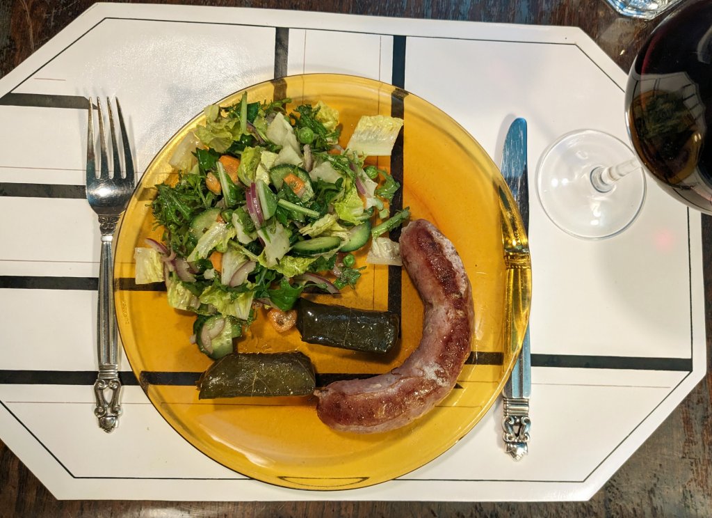 Whtie wine and shallot sausage, dolmas, and a salad.jpg