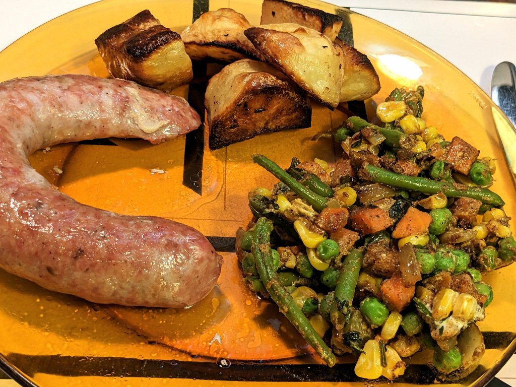 Wild mushroom sausages with veg with Madras curry paste, and Greek style roast, lemon potatoes.jpg