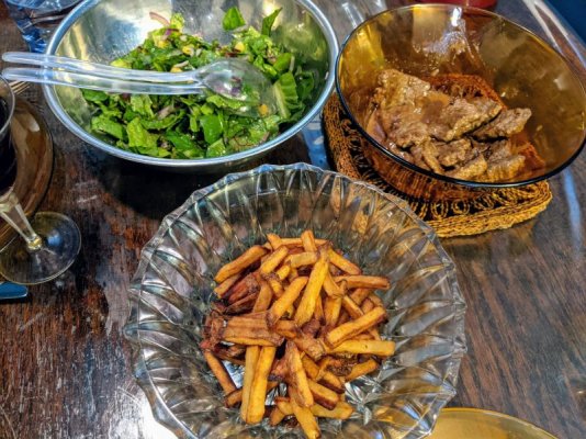 Steak strips in creamy pan sauce, leafy salad with vinaigrette, and duck fat fries.jpg