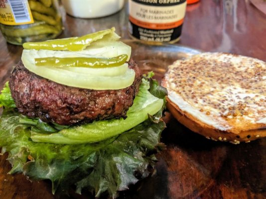 Grilled burger on sesame kaiser bun with mayo, seedy mustard, onion, lettuce, and pickled hot pe.jpg
