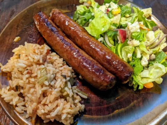 Merguez sausages, rice pilaf, and a salad.jpg